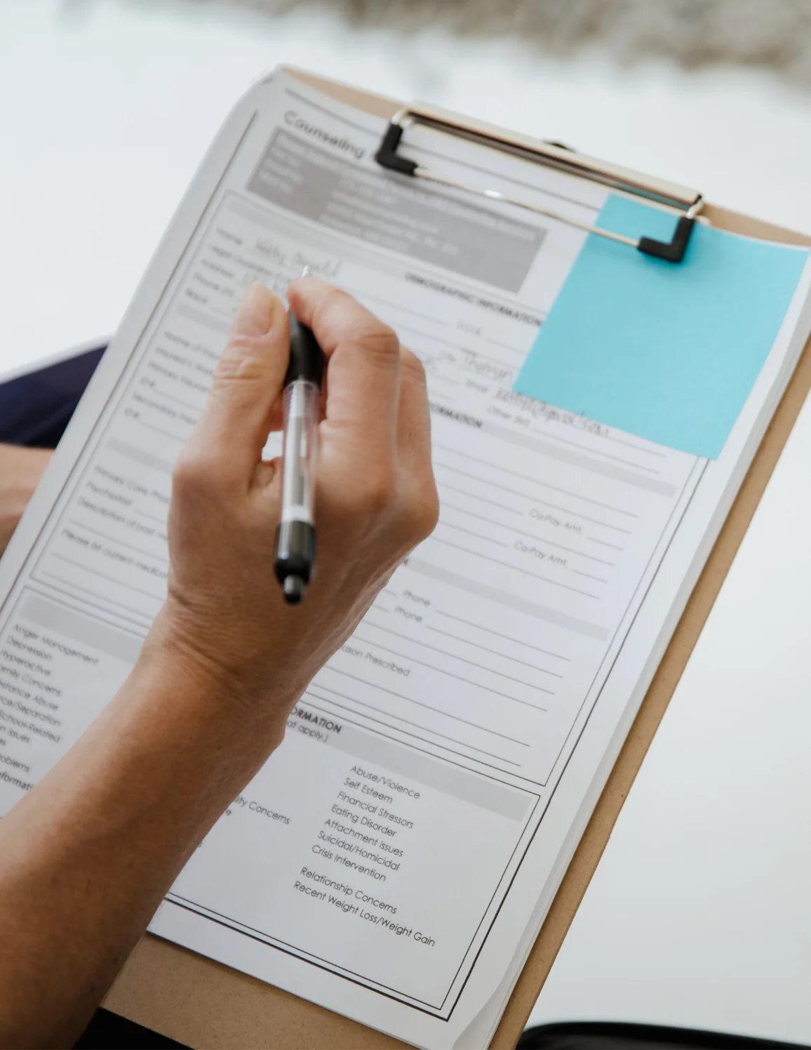 Patient completing dental forms